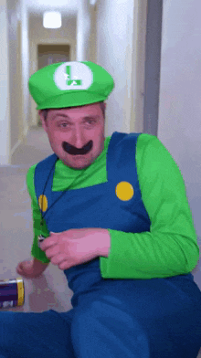 a man dressed as luigi from super mario looks at the camera