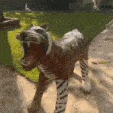 a statue of a dog with its mouth open