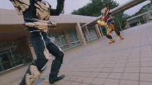 a man in a superhero costume is running on a sidewalk