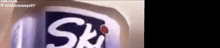 a close up of a can of ski with a red dot on it