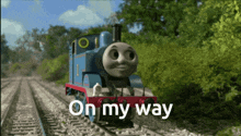 thomas the train is on the tracks with the words on my way above him