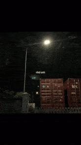 two shipping containers with tek written on the side