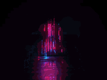 a dark room with purple and blue lights coming out of a doorway