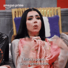 a woman sitting on a couch with the words amazon prime written on the bottom