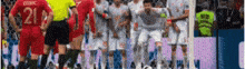 a blurry picture of a soccer game with a player wearing the number 21