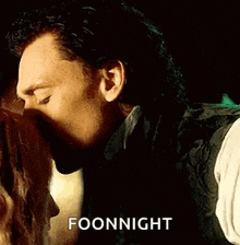 a close up of a man 's face with the words `` foonnight '' written on it .