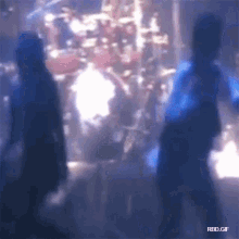a blurry picture of a person standing in front of a drum set with the words rbd.gif at the bottom
