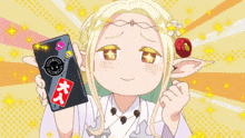 a girl is holding a cell phone with a sticker on it that says ' a ' on it