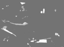 a black and white photo of a person 's face with a gray background