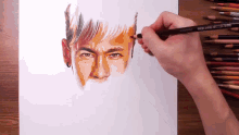 a person is drawing a man 's face with a colored pencil that says prismacolor on it