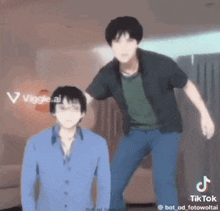 two men are standing next to each other in a room and one of them is wearing a blue shirt .