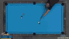 a pool table with a man playing pool and a diamond las vegas open logo