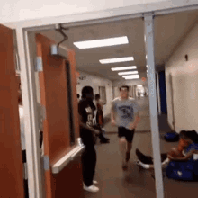 Ouch Kid Knocks Himself Out On Doorphrame GIF