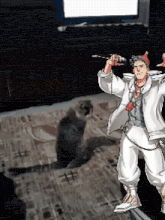 a man in a white suit is holding a microphone