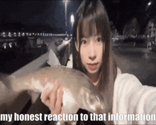 a girl is holding a large fish with the words my honest reaction to that information above her