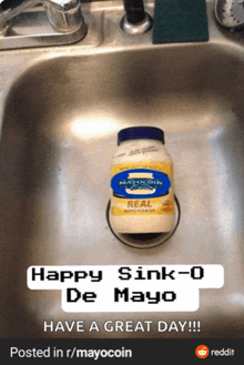 a bottle of mayo sits in a kitchen sink