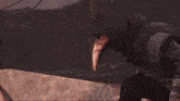 a close up of a monster 's mouth with sharp teeth .