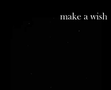 a black background with the words make a wish written on it