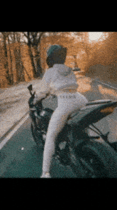 Biker Biker Girl GIF - Biker Biker Girl White Bike GIFs