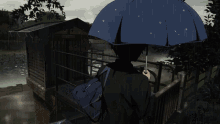 a person holding an umbrella in the rain with a reflection of a person in the background