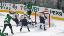 a hockey game is being played in front of a 7 eleven sign