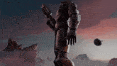 a statue of a man holding a gun with a halo logo on his arm