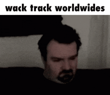 a man with a beard and the words wack track worldwides on the bottom