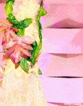 a woman is wearing a dress with flowers and leaves on it ..
