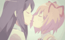 a couple of anime girls kissing each other with their eyes closed and their mouths open