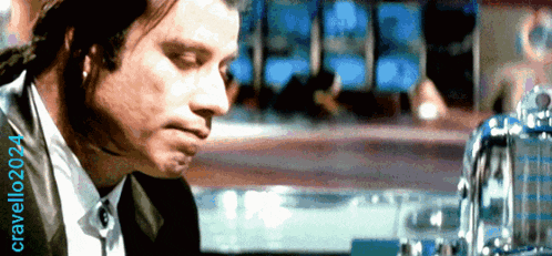 a man in a suit sits at a bar with the year 2024 written on the bottom