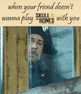 a man in a pirate hat is peeking out of a window with a quote from skull and bones below him