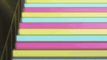 a set of stairs with pink yellow and blue stripes on the steps