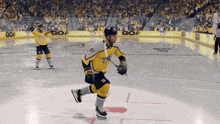 a hockey player in a yellow jersey with the number 18 on it