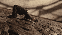 a person laying on their back in a muddy area