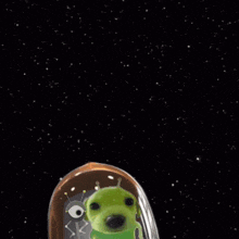 a green alien is flying in a space ship with the word send written on the bottom