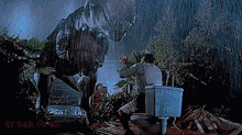 a man is sitting on a toilet in front of a dinosaur in the rain