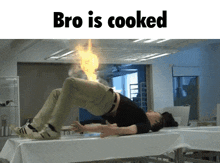 a man laying on a table with a fire coming out of his butt and the words bro is cooked above him