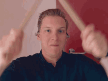 hitting drumsticks george ezra goofing off playing hyped