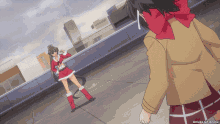 a girl in a santa outfit is standing next to another girl in a brown jacket