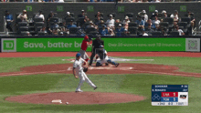a baseball game is being played in front of an advertisement for td
