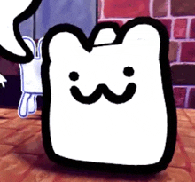 a black and white cartoon character with a smile on its face is standing on a tiled floor .