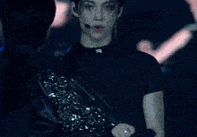 a close up of a person wearing a black leather jacket