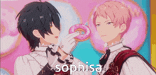 a couple of anime characters are standing next to each other and one of them is holding a donut in his hand .