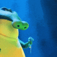 a frog with a blue background is holding a key in its hand