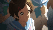 a girl with short brown hair and a red ribbon in her hair