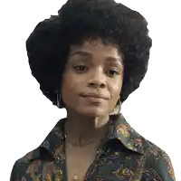 a woman with an afro is wearing a paisley shirt and hoop earrings