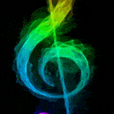 a colorful treble clef with smoke coming out of it on a black background