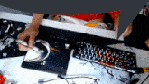 a person is painting a picture on a mouse pad that says death on it