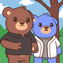 two teddy bears are standing next to each other in a park