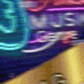 a blurred image of a neon sign that says ' us ' on it